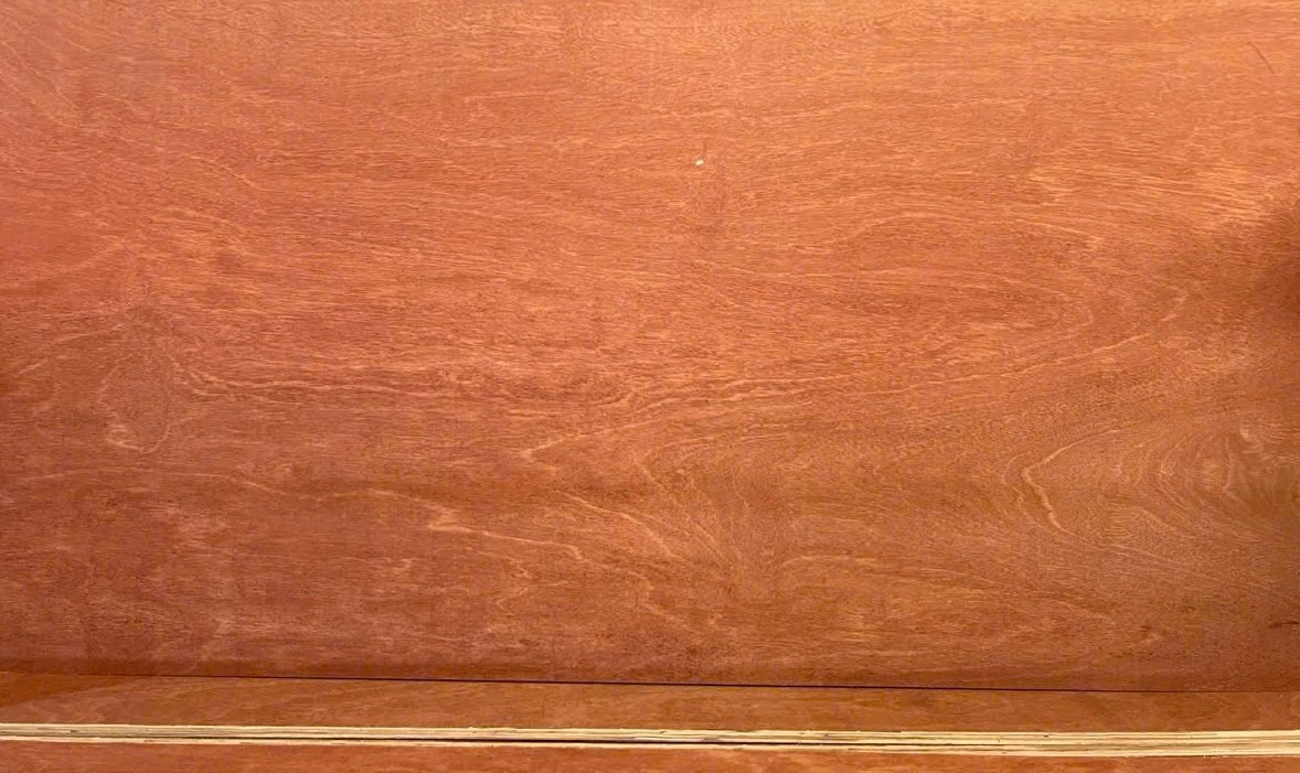 Warm red-brown gurjan plywood face with broad grain figure